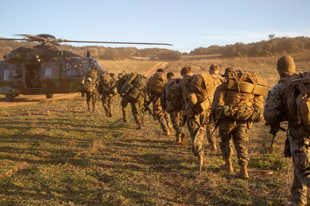 U.S. and Hellenic Marines load into an NH90 Tactical Transport Helicopter during Exercise Alexander the Great 2020 in Volos, Greece, Feb. 2.