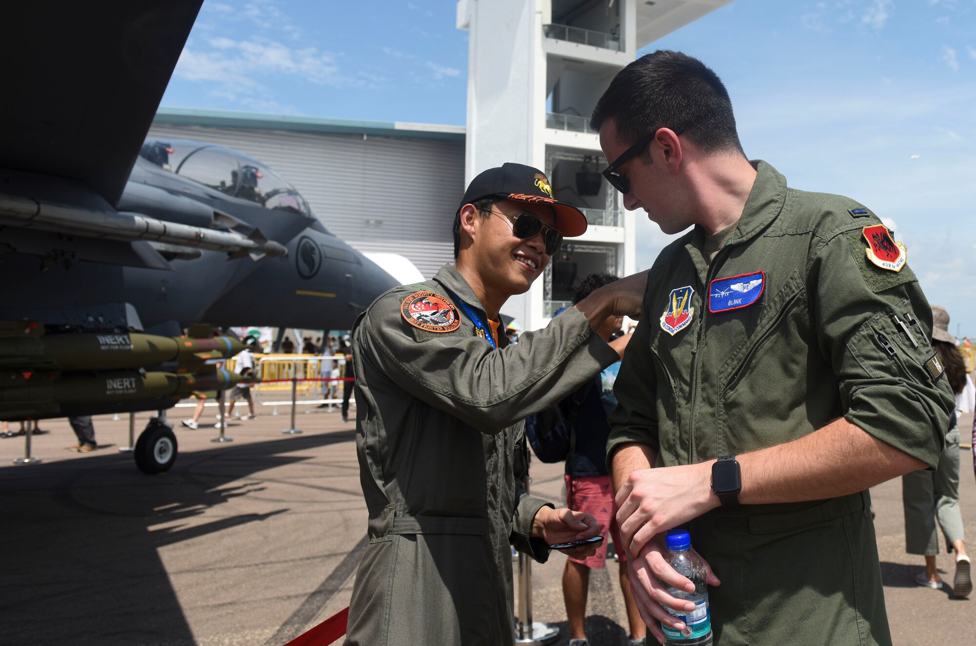Pilots trade patches at Singapore Airshow.