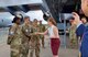 Kelli L. Seybolt, Deputy Under Secretary of the Air Force, International Affairs, coins a 432nd Wing Airman.