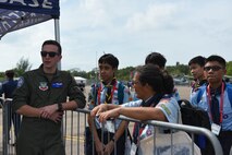 An MQ-9 Reaper pilot chats with Singapore Scouts at Singapore Airshow.