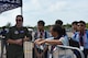 An MQ-9 Reaper pilot chats with Singapore Scouts at Singapore Airshow.