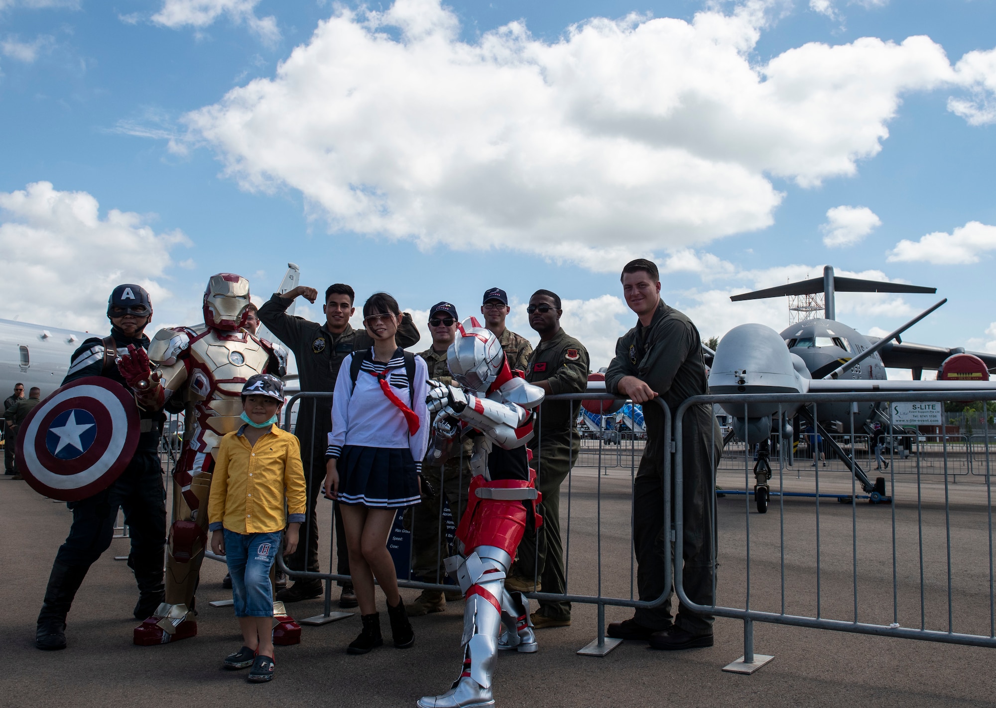 Airmen and Marines with UAS aircraft meet with Singapore Airshow guests.