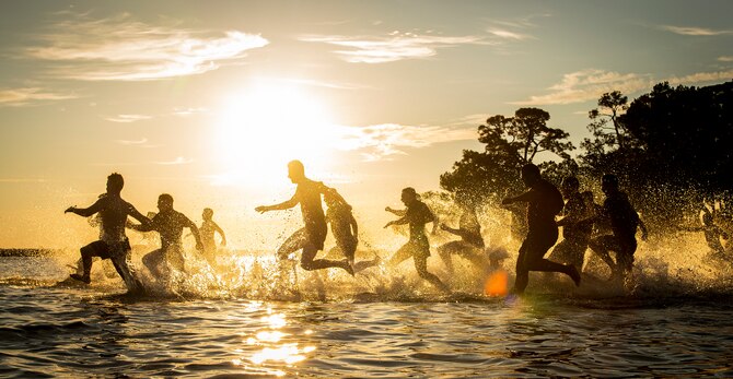 Team Eglin members take the Polar Bear Plunge into Choctawhatchee Bay Jan. 17 at Eglin Air Force Base, Fla. The almost 100 “plungers” also completed the annual Resolution Run prior to their quick dip in the bay. Warm drinks and food awaited those who took part in the plunge. (U.S. Air Force photo/Samuel King Jr.)