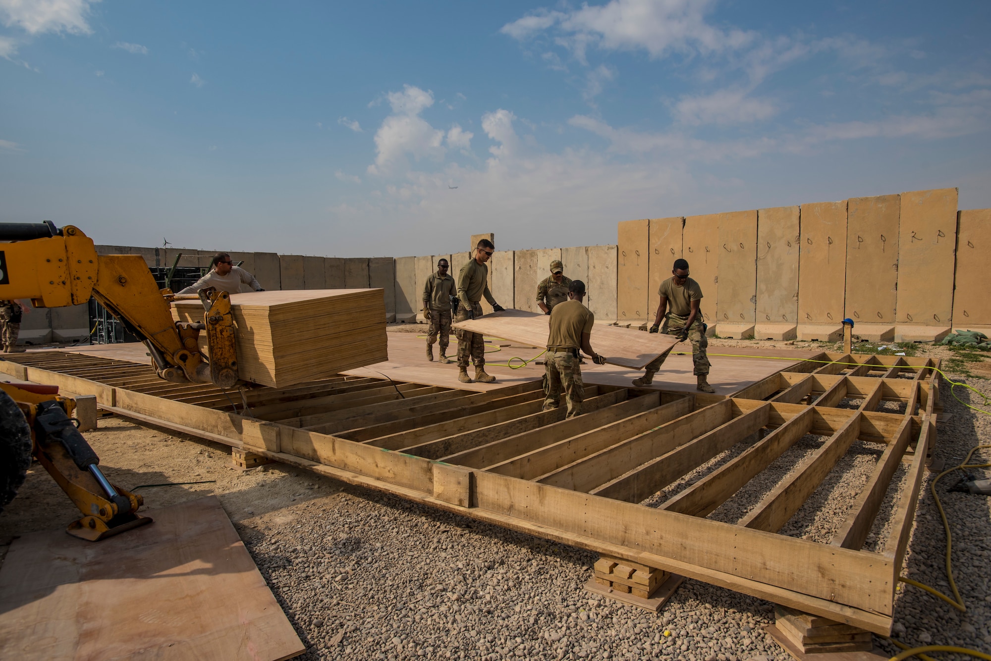 Airmen replacing damaged structures