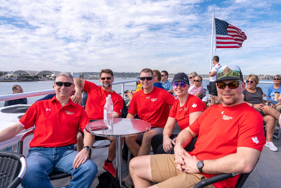 Athletes from Team Canada observe the San Diego Harbor from the deck of the Hornblower Cruise during the 2020 Marine Corps Trials International Day at San Diego, California, Feb. 28. The Trials, involving nearly 200 wounded, ill or injured Marines, Sailors, veterans and international competitors, promotes recovery and rehabilitation through adaptive sport participation and develops camaraderie among recovering service members and veterans.