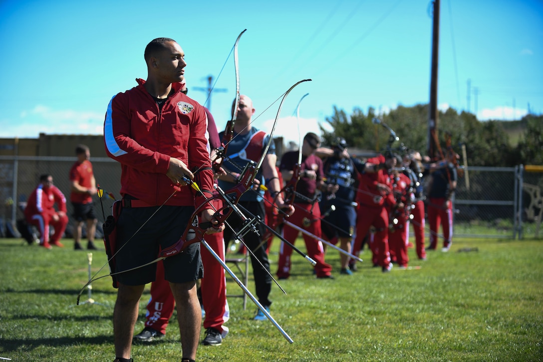 Recovering service members competing in the 2020 Marine Corps Trials adjust their bows and practice shooting techniques at Marine Corps Base Camp Pendleton, Calif., March 2. The Marine Corps Trials is an adaptive sports event involving more than 200 wounded, ill or injured Marines, Sailors, veterans and international competitors.