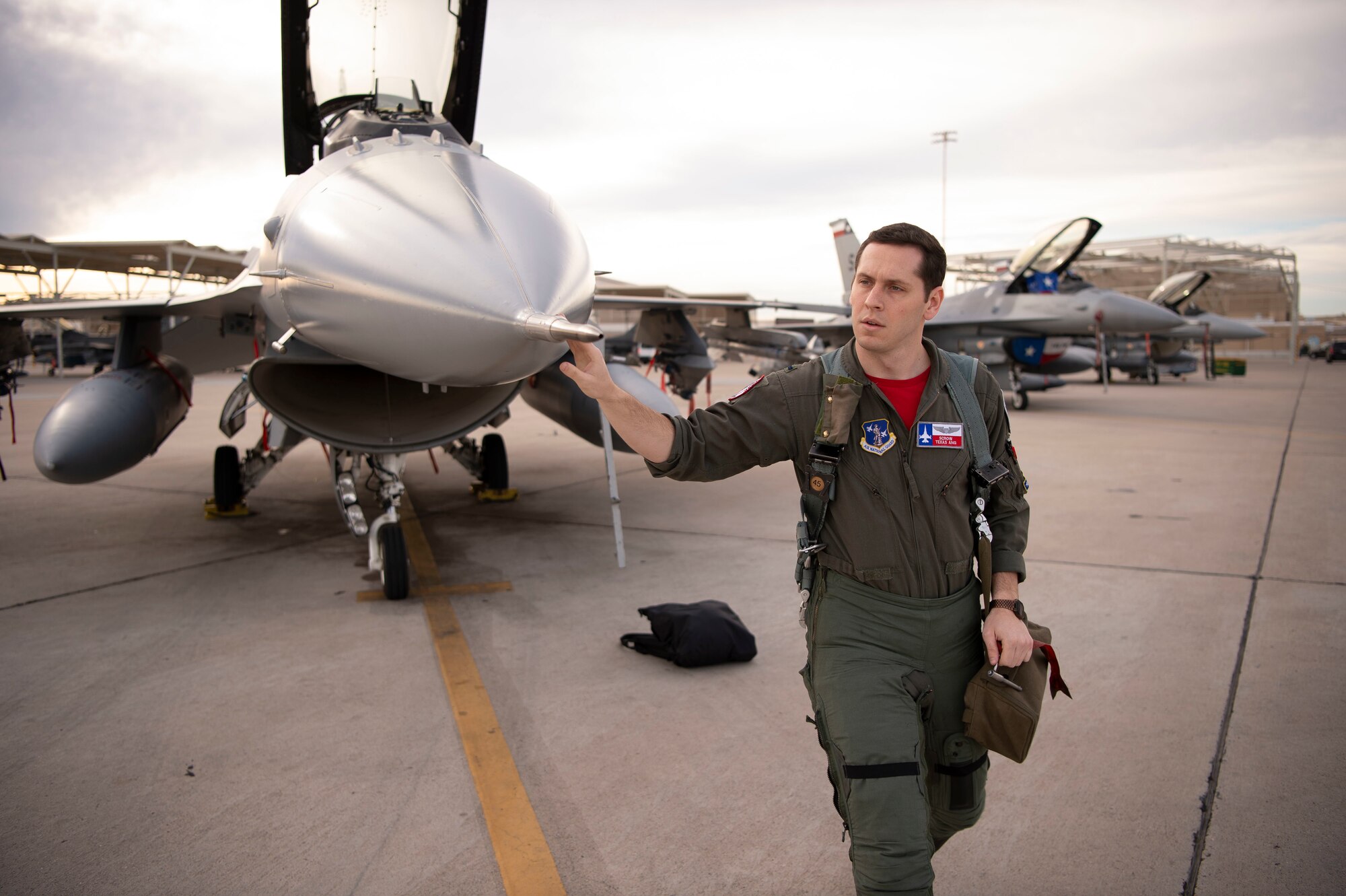 First Lt. James Demkowicz, a student F-16 pilot assigned to the 149th Fighter Wing, Air National Guard, conducts pre-flight checks prior to launch during Coronet Cactus, Feb. 28, 2020, at Luke Air Force Base, Ariz. The annual training event deploys members of the 149th FW, headquartered at Joint Base San Antonio-Lackland, Texas, to another environment in order to familiarize them with accomplishing mission objectives in an unfamiliar location. (Air National Guard photo by Staff Sgt. Derek Davis)