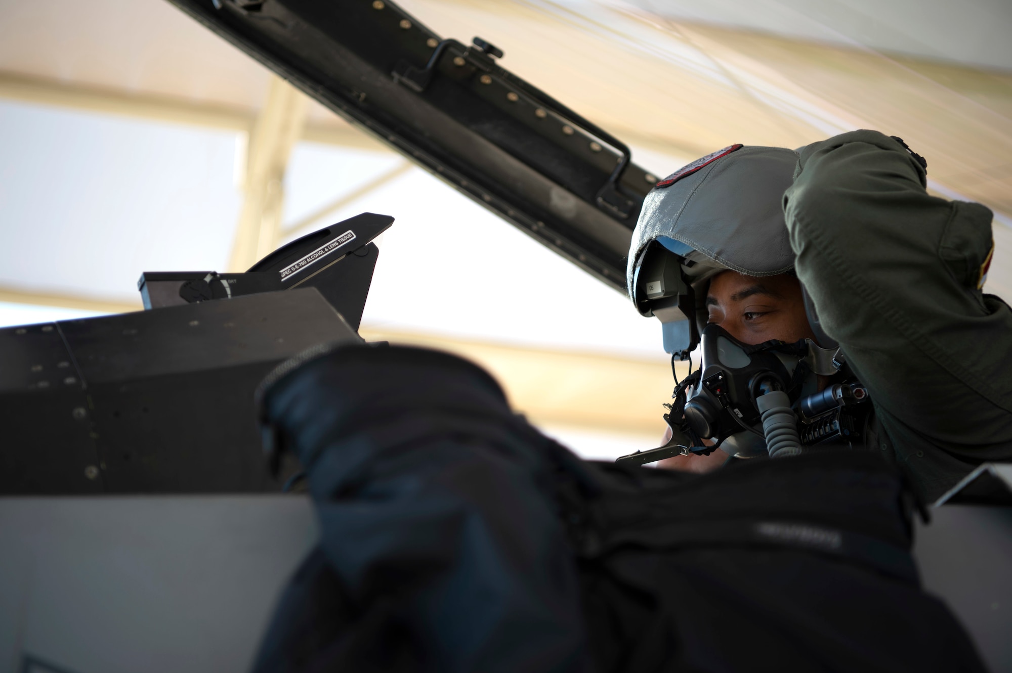 First Lt. Marcus Ward, a student pilot assigned to the 149th Fighter Wing, Air National Guard, tests his face mask prior to launch during Coronet Cactus, Feb. 27, 2020, at Luke Air Force Base, Ariz. The annual training event deploys members of the 149th Fighter Wing, headquartered at Joint Base San Antonio-Lackland, Texas, to another environment in order to familiarize them with accomplishing mission objectives in an unfamiliar location. (Air National Guard photo by Staff Sgt. Derek Davis)