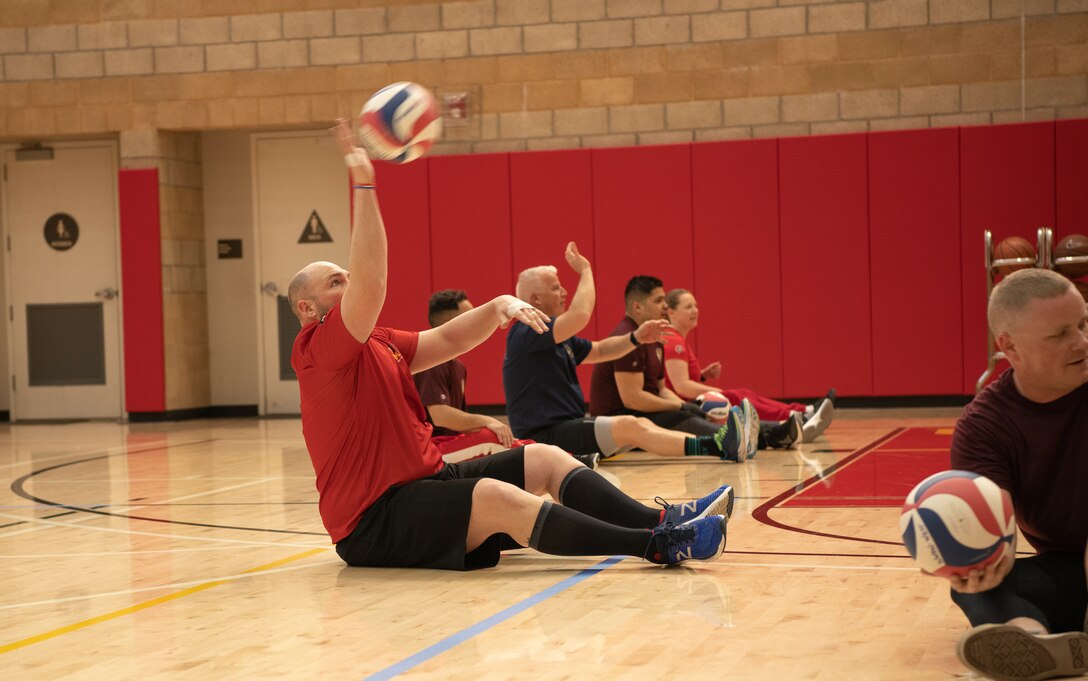 Athletes competing in the 2020 Marine Corps Trials conduct passing drills during sitting volleyball practice at Marine Corps Base Camp Pendleton, California, Mar. 1. The Marine Corps Trials promotes recovery and rehabilitation through adaptive sport participation and develops camaraderie among recovering service members.