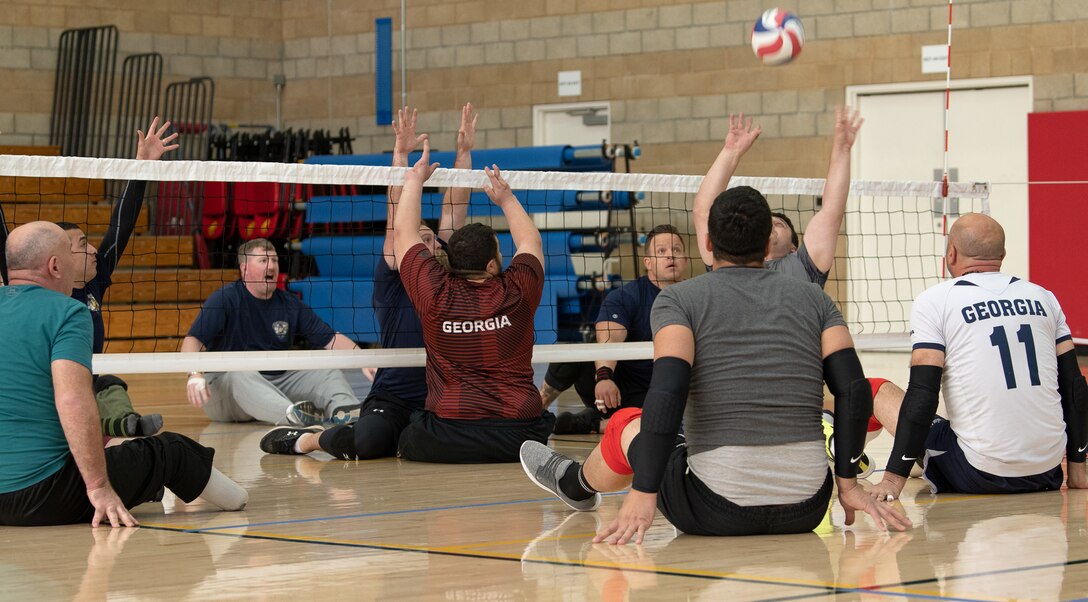 Marine Corps Trials teams Wounded Warrior Battalion-West and Georgia play a practice game of sitting volleyball at Marine Corps Base Camp Pendleton, California, Mar. 3. The Marine Corps Trials promotes recovery and rehabilitation through adaptive sport participation and develops camaraderie among recovering service members.