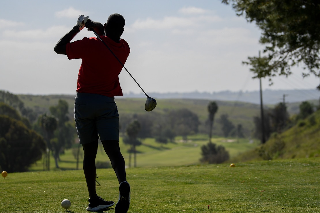 An athlete watches his shot during the 2020 Marine Corps Trials golf tournament at Marine Corps Base Camp Pendleton, Calif., March 4. The Marine Corps Trials promotes recovery and rehabilitation through adaptive sports participation and develops camaraderie among recovering service members.