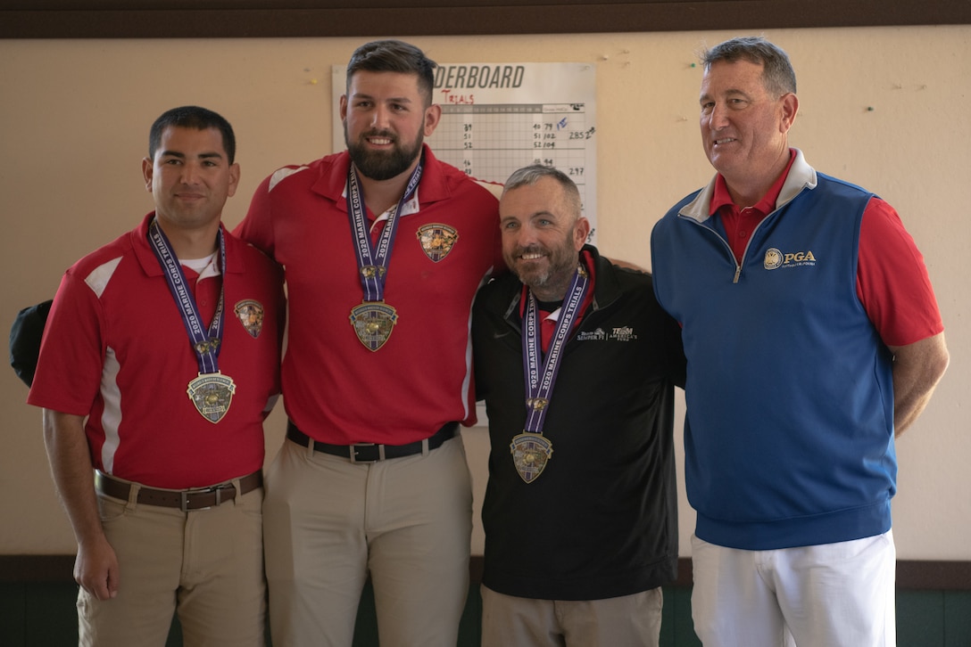 U.S. Marine Corps Staff Sgt.Eric Aragon (far left),and U.S. Marine Corps veterans Peter Lykins (center right) and Michael Sousadecarmo (center left) win the gold, silver and bronze medals, respectively, during the 2020 Marine Corps Trials golf tournament at Marine Corps Base Camp Pendleton, Calif., March 4. The Marine Corps Trials promotes recovery and rehabilitation through adaptive sports participation and develops camaraderie among recovering service members.