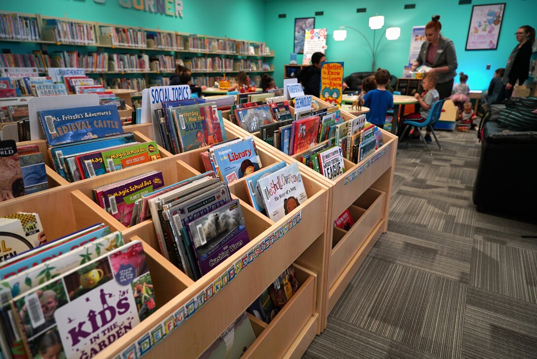 A group of children work on a craft project in the “kid’s corner” March 4, 2020, in the library on Grand Forks Air Force Base, N.D. The base library re-opened following a six-month renovation, which focused on improving accessibility and meeting the needs of the community with new shelves, carpet, paint and signage. (U.S. Air Force photo by Senior Airman Elora J. McCutcheon)