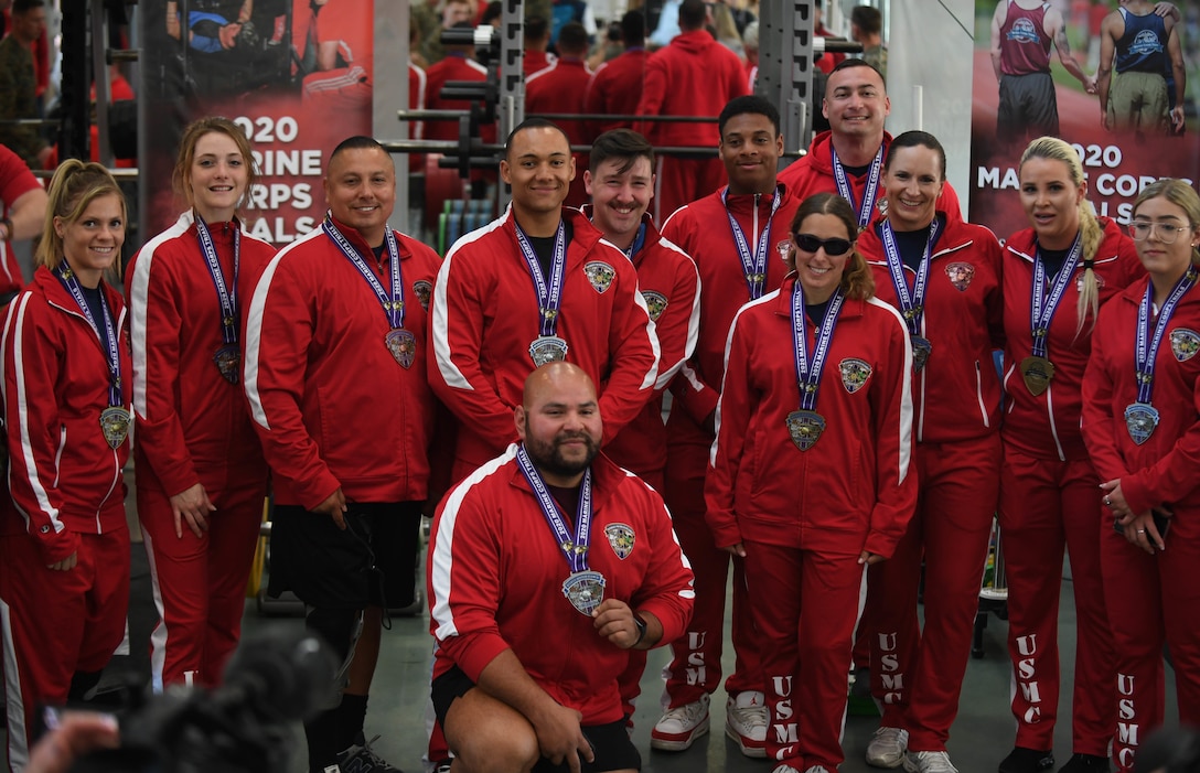 U.S. Marine Corps Wounded Warrior Battalion West athletes gather to show the medals won during the 2020 Marine Corps Trials powerlifting competition at Marine Corps Base Camp Pendleton, Calif., March 4. The Marine Corps Trials promotes recovery and rehabilitation through adaptive sports participation and develops camaraderie among recovering service members and veterans.