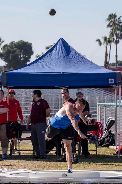 A service member from Team France throws a shot put during the 2020 Marine Corps Trials competition at Marine Corps Base Camp Pendleton, California, March 5, 2020. The Marine Corps Trials promotes rehabilitation through adaptive sports participation for recovering service members and veterans all over the world.