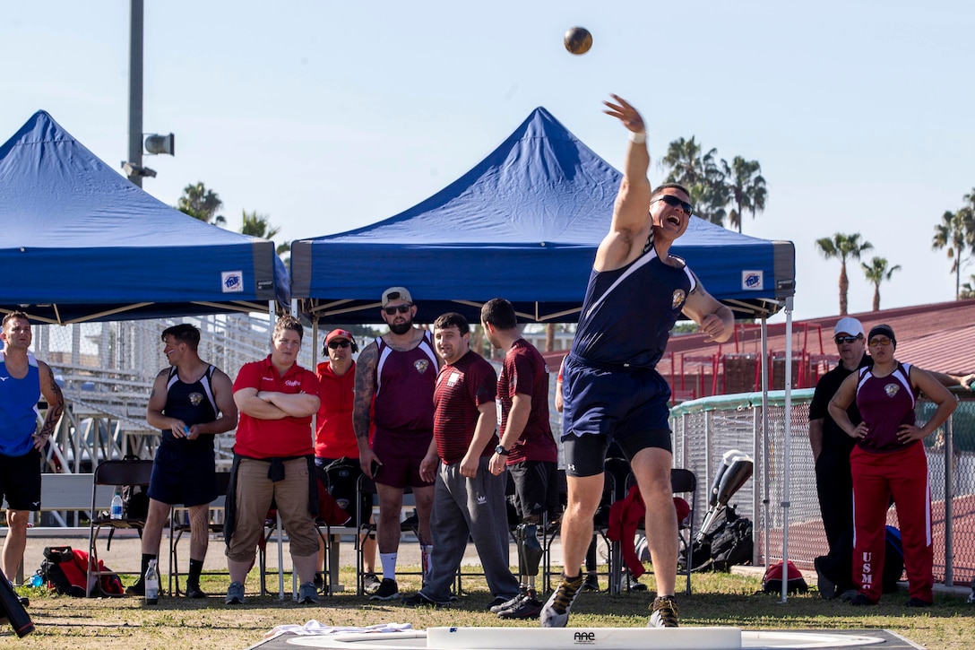 U.S. Marine Gunnery Sgt. Dorian Gardner, the Communication Strategy and Operations chief with Marine Corps Installations West, throws a shot put during the 2020 Marine Corps Trials competition at Marine Corps Base Camp Pendleton, California, March 5, 2020. The Marine Corps Trials promotes rehabilitation through adaptive sports participation for recovering service members and veterans all over the world.