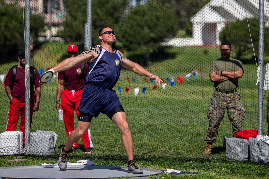 U.S. Marine Gunnery Sgt. Dorian Gardner, the Communication Strategy and Operations chief with Marine Corps Installations West, throws a discus during the 2020 Marine Corps Trials competition at Marine Corps Base Camp Pendleton, California, March 5, 2020. The Marine Corps Trials promotes rehabilitation through adaptive sports participation for recovering service members and veterans all over the world.