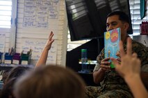 U.S. Marine Corps Col. Raul Lianez, commanding officer, Marine Corps Base Hawaii, displays Dr. Seuss’ the Lorax during a visit to Mokapu Elementary School, March 2, 2020. Lianez visited Mokapu Elementary to read books to the students and stress the importance of reading and learning on National Read Across America Day. (U.S. Marine Corps photo by Lance Cpl. Samantha Sanchez)