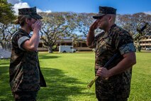 U.S. Marine Corps Sgt. Maj. Robert Ixtlahuac, off-going sergeant major, Headquarters Battalion, Marine Corps Base Hawaii, salutes Lt. Col. Carrie Batson, commanding officer, HQBN, MCBH, during the HQBN, MCBH, relief and appointment ceremony, MCBH, March 5, 2020. Sgt. Maj. Robert Ixtlahuac relinquished responsibilities to Sgt. Maj. Alfonso Ramos Jr. (U.S. Marine Corps photo by Cpl. Matthew Kirk)