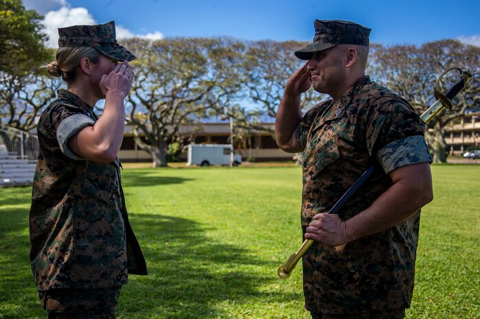 U.S. Marine Corps Sgt. Maj. Robert Ixtlahuac, off-going sergeant major, Headquarters Battalion, Marine Corps Base Hawaii, salutes Lt. Col. Carrie Batson, commanding officer, HQBN, MCBH, during the HQBN, MCBH, relief and appointment ceremony, MCBH, March 5, 2020. Sgt. Maj. Robert Ixtlahuac relinquished responsibilities to Sgt. Maj. Alfonso Ramos Jr. (U.S. Marine Corps photo by Cpl. Matthew Kirk)