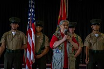 Mrs. Barbara Mathews speaks to service members and guests during an Honorary Marine ceremony, Marine Corps Base Hawaii, March 6, 2020. The Honorary Marine title is designed to reinforce the special bond between the American people and the Marine Corps by recognizing individuals in the civilian community who have made extraordinary contributions to the Marine Corps. Mrs. Mathews earns this prestigious honor for volunteering over 10 years of her personal time, talents and money capturing photo and video of hundreds of Marine Corps ceremonies, including memorials and special events surrounding the wars in Iraq and Afghanistan. (U.S. Marine Corps photo by Cpl. Matthew Kirk)