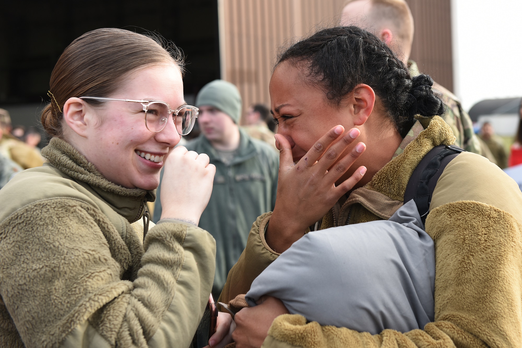 Friends and family welcome Airmen assigned to the 494th Fighter Squadron home from deployment at Royal Air Force Lakenheath, England, March 4, 2020. Airmen from the 48th Fighter Wing returned from a deployment supporting U.S. Air Force Central Command.  (U.S. Air Force photo by Airman 1st Class Jessi Monte)