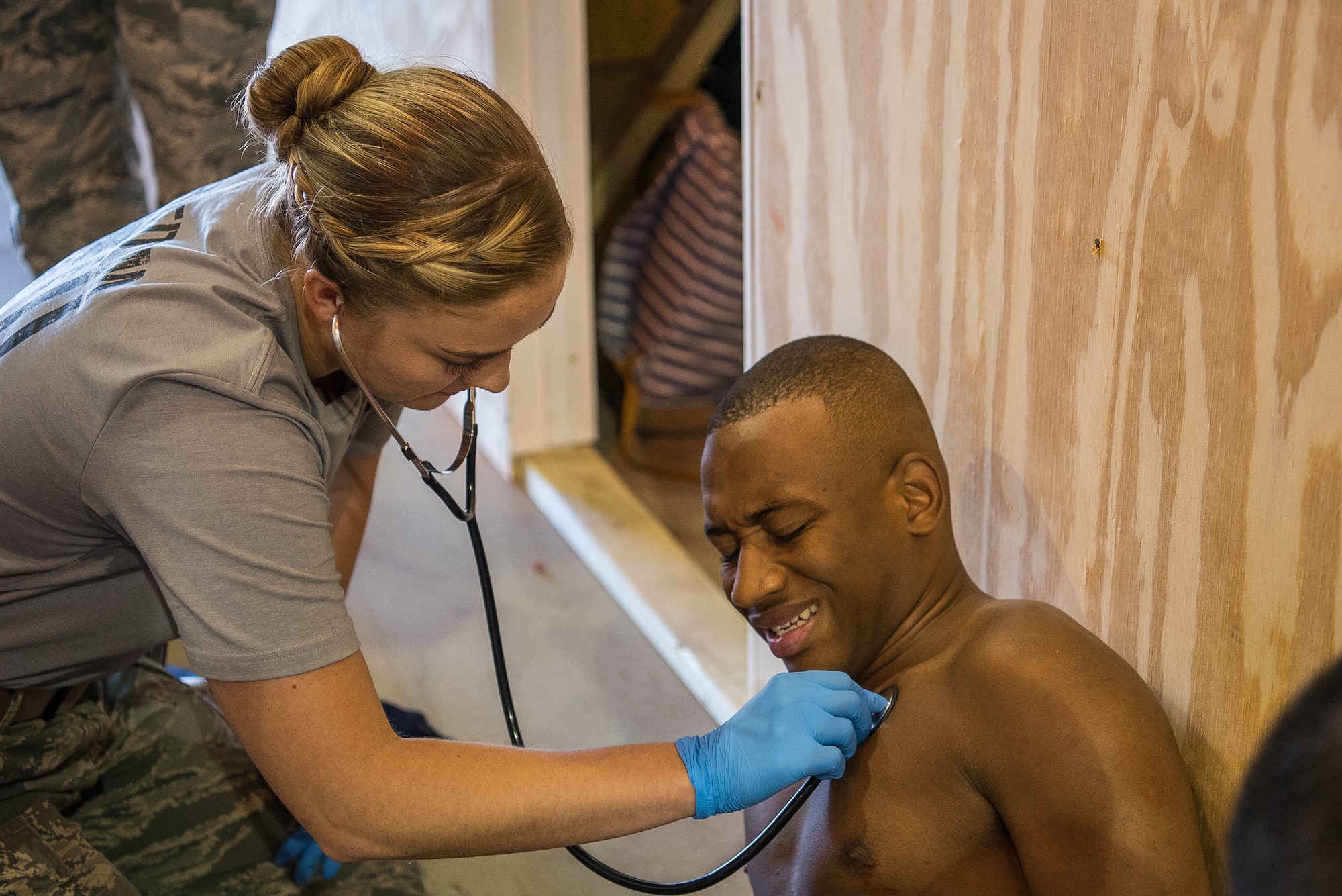 Airman 1st Class Sinéad Brosnan, 27th Special Operations Health Care Operations Squadron aerospace medical technician, checks the heartrate of an actor during a stab victim scenario at the 2018 EMT Rodeo at Cannon Air Force Base, N.M., Aug. 8, 2018. Brosnan was the team leader for Cannon’s team at the 2018 EMT Rodeo and the 2019 Medic Rodeo. (U.S. Air Force photo by Airman 1st Class Vernon R. Walter III)