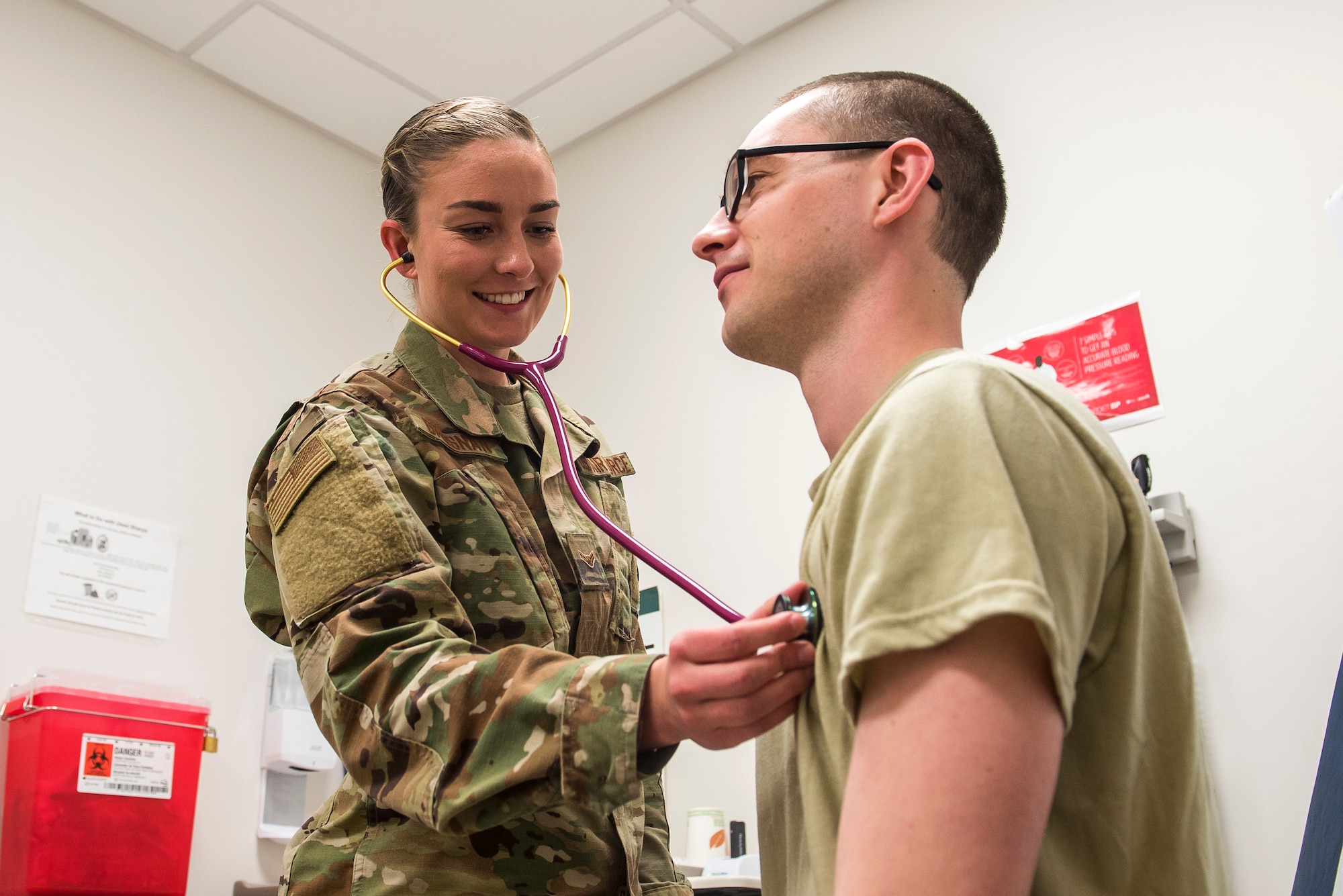 U.S. Air Force Airman 1st Class Sinéad Brosnan, 27th Special Operations Health Care Operations Squadron aerospace medical technician, checks the heart rate of Airman 1st Class Brandon O’Bryant, 27 SOHCOS aerospace medical technician, at Cannon Air Force Base, New Mexico, March 3, 2020. To further her career, Brosnan plans on applying for the Independent Duty Medical Technician program to become a Special Operations Forces Medical Element member. (U.S. Air Force photo by Senior Airman Vernon R. Walter III)
