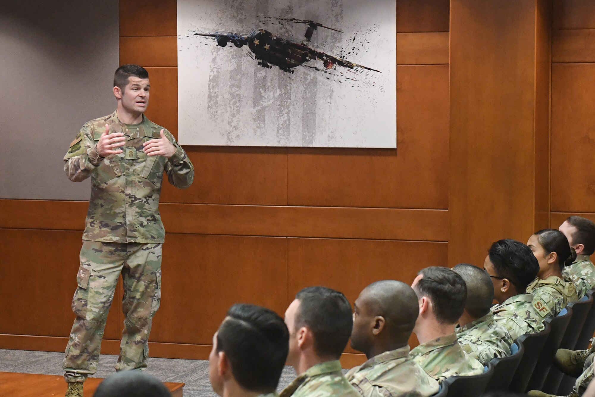 Chief Master Sgt. Tony Jenkins, 621st Contingency Response Wing command chief, speaks to Airmen during an all call May 9, 2019, at Travis Air Force Base, California. During his visit, Jenkins discussed a variety of topics to include mentoring, promotions, fitness and deployments. (U.S. Air Force photo by Tech. Sgt. Liliana Moreno)