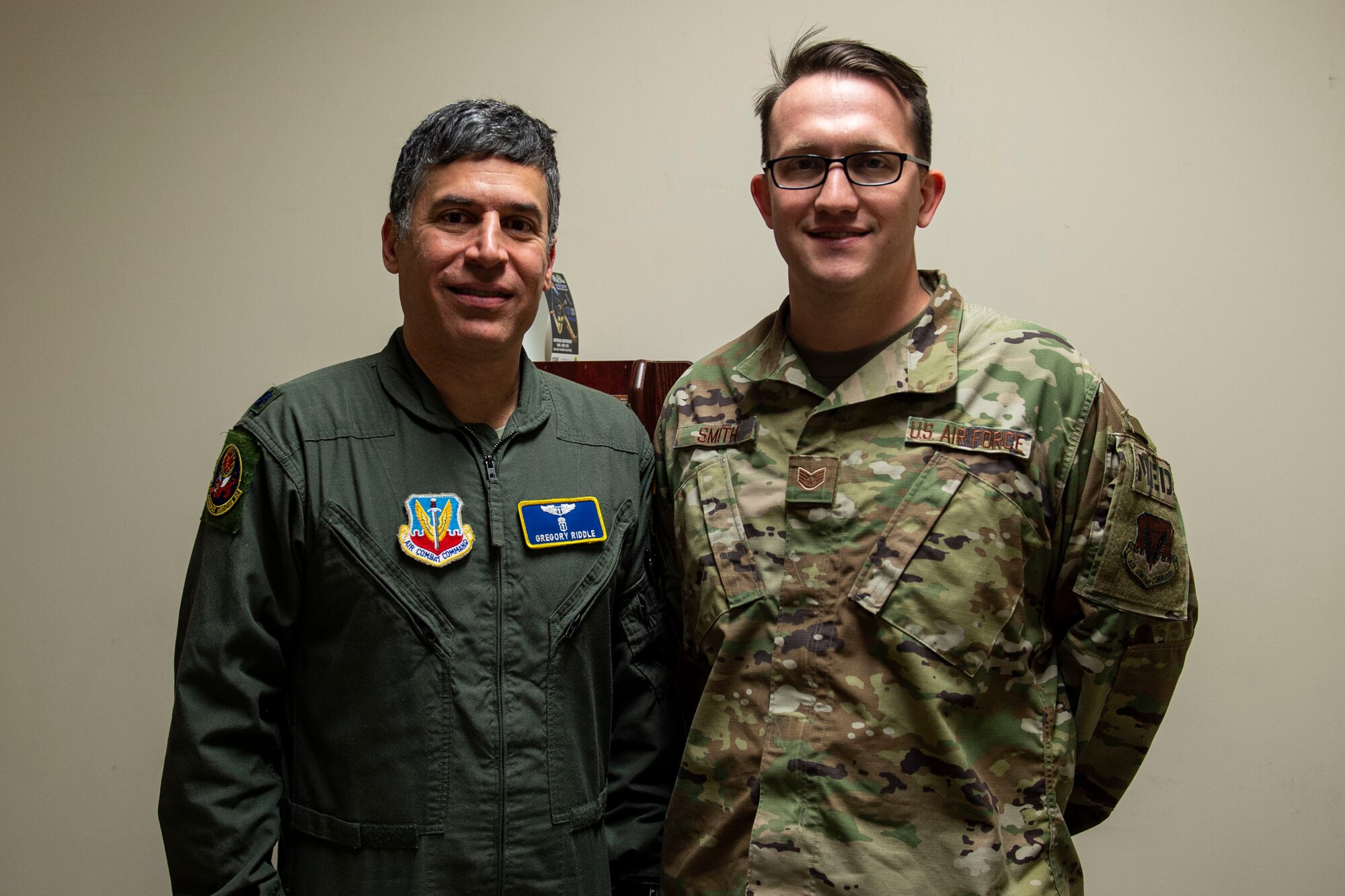 Photo of two Airmen posing for a photo.