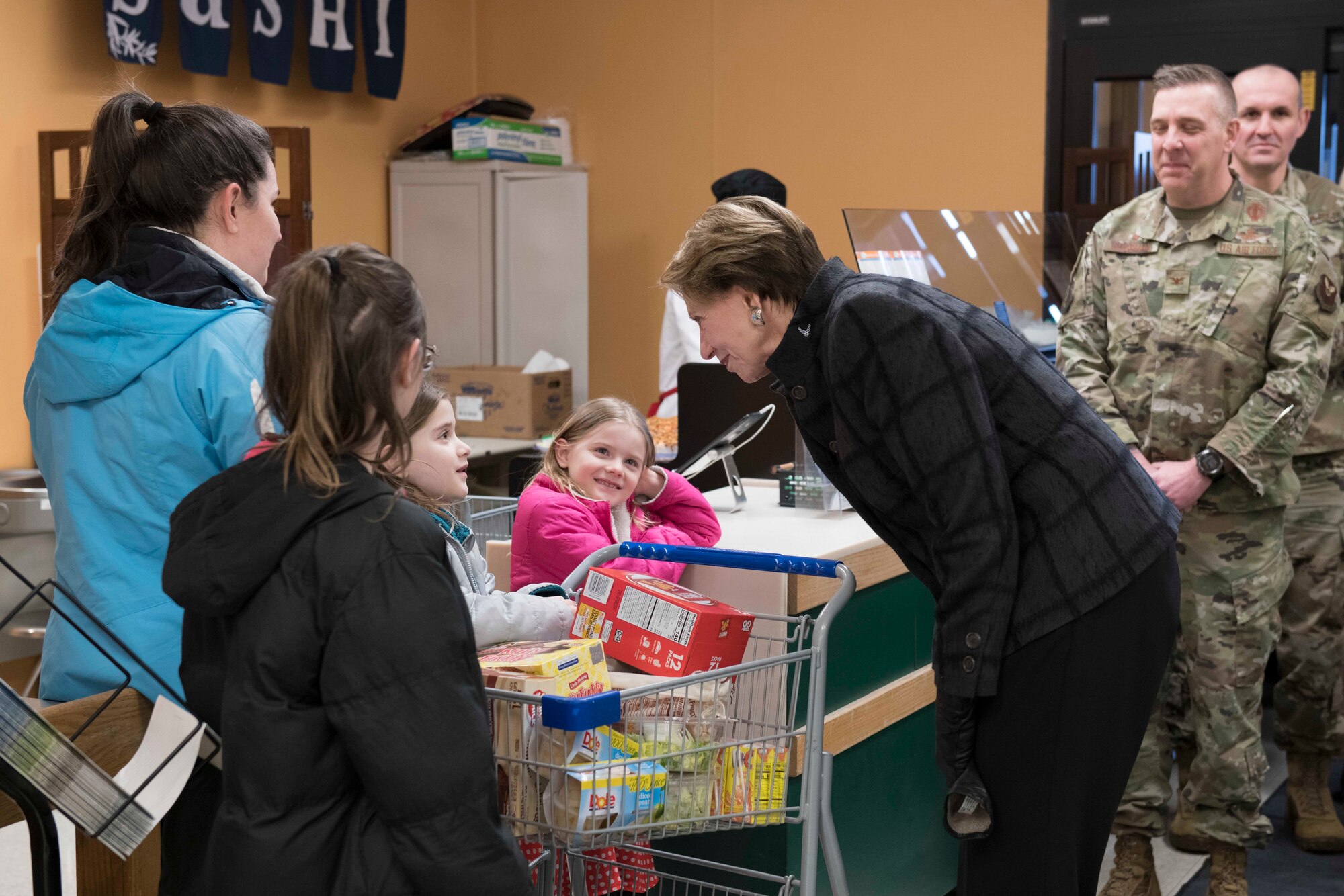 SecAF talks with a little girl at the Minot AFB commissary