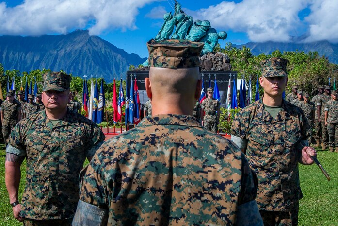 U.S. Marine Corps Sgt. Maj. Alejandro Garcia Jr. (left), on-coming sergeant major, Marine Unmanned Aerial Vehicle Squadron 3, and Sgt. Maj. Alfonso Ramos Jr., off-going sergeant major, VMU-3, stands at attention during the VMU-3 relief and appointment ceremony, Marine Corps Base Hawaii, March 4, 2020. Sgt Maj. Alfonso Ramos Jr. relinquished responsibilities to Sgt. Maj. Alejandro Garcia Jr. (U.S. Marine Corps photo by Cpl. Matthew Kirk)
