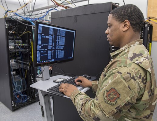 Service member monitors cyber threat.