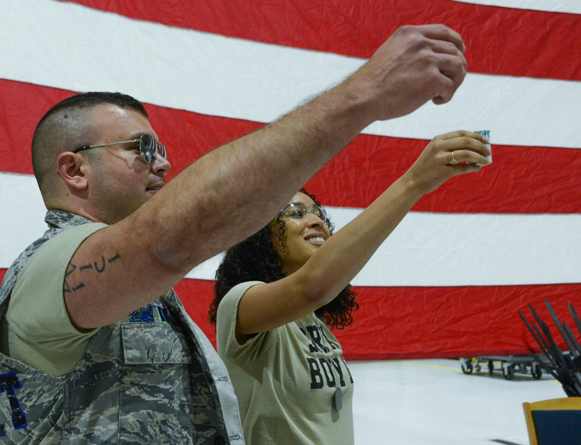 Texas Air National Guard Airmen lift their cups in a toast.