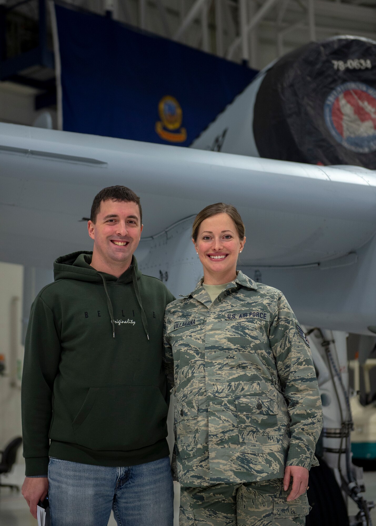 Staff Sgt. Mason Allen stands next to his sister, Staff Sgt. Camas Villafana, in front of an A-10 Thunderbolt II assigned to the 124th Fighter Wing, Gowen Field, Boise, Idaho, Feb. 20, 2020. Staff Sgt. Allen enlisted as a biomedical equipment specialist with the 124th Medical Group on Feb. 20, 2020. (U.S. Air National Guard photo by Ryan White)