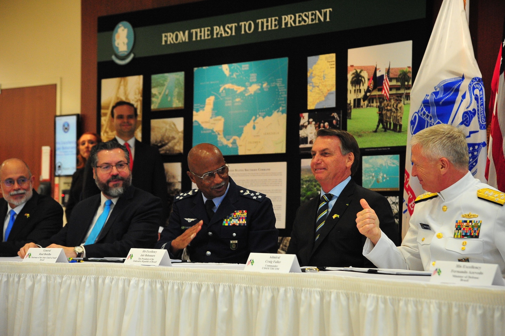 Military leaders sign an agreement.