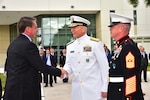 Brazilian President Jair Bolsonaro arrives at U.S. Southern Command headquarters and is greeted by Navy Adm. Craig Faller.