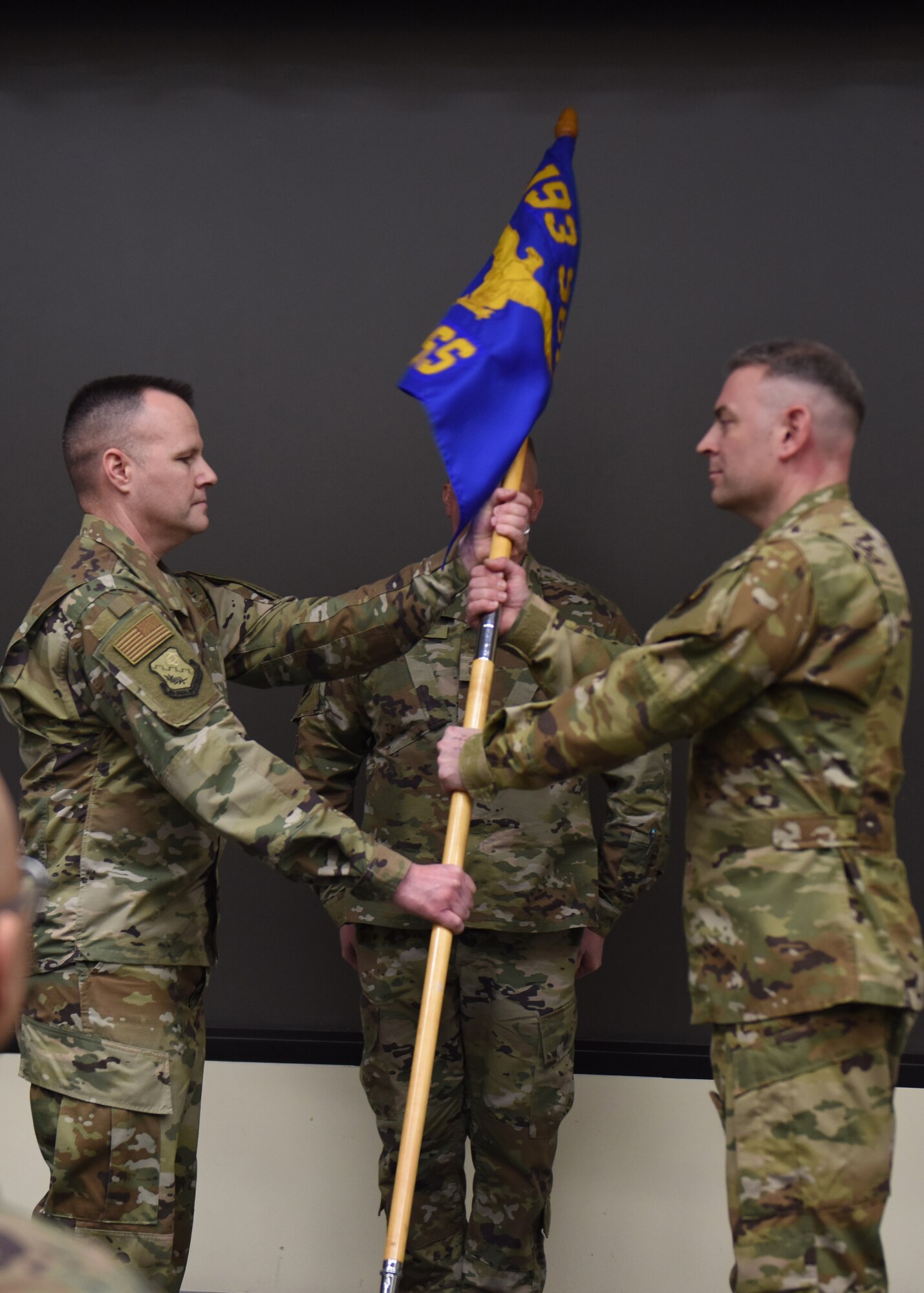 U.S. Air Force Lt. Col. Brian Jones (right), 193rd Special Operations Support Squadron commander, accepts command from Lt. Col. Dereck Rogers,193rd Special Operations Group commander, during a change of command ceremony March 7, 2020, in Middletown, Pennsylvania. The ceremony began with preliminary honors and ended with the symbolic passing of the guidon. (U.S. Air National Guard photo by Staff Sgt. Rachel Loftis/Released)