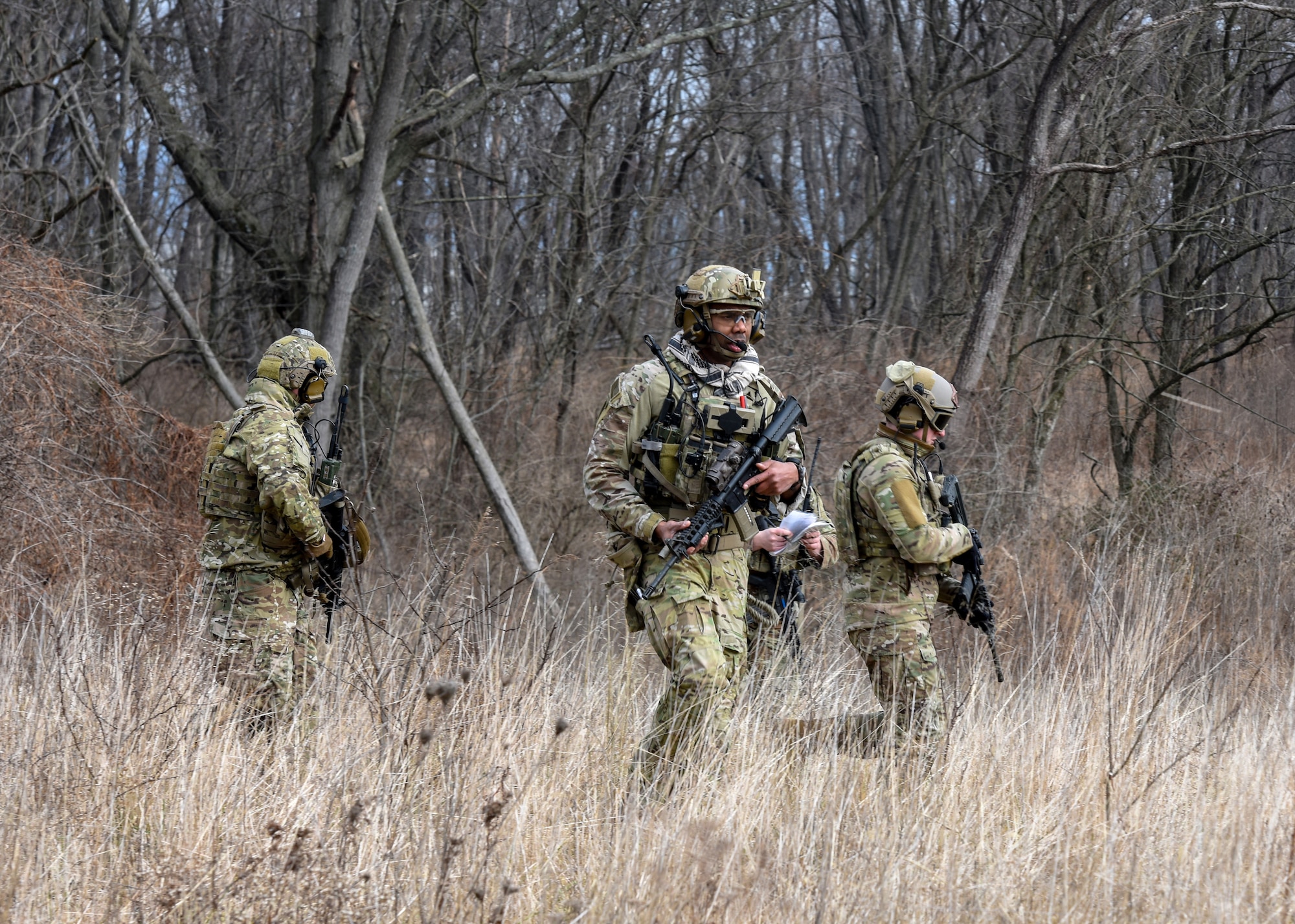 U.S. Air Force Tactical Air Control Party Specialists with the 148th Air Support Operations Squadron survey an area Feb. 9, 2020, as part of a training exercise at Fort Indiantown Gap, Annville, Pennsylvania. The training exercise tested the Airmen on practical applications of shooting, moving, communicating and medical response. (U.S. Air National Guard photo by Staff Sgt. Rachel Loftis/Released)