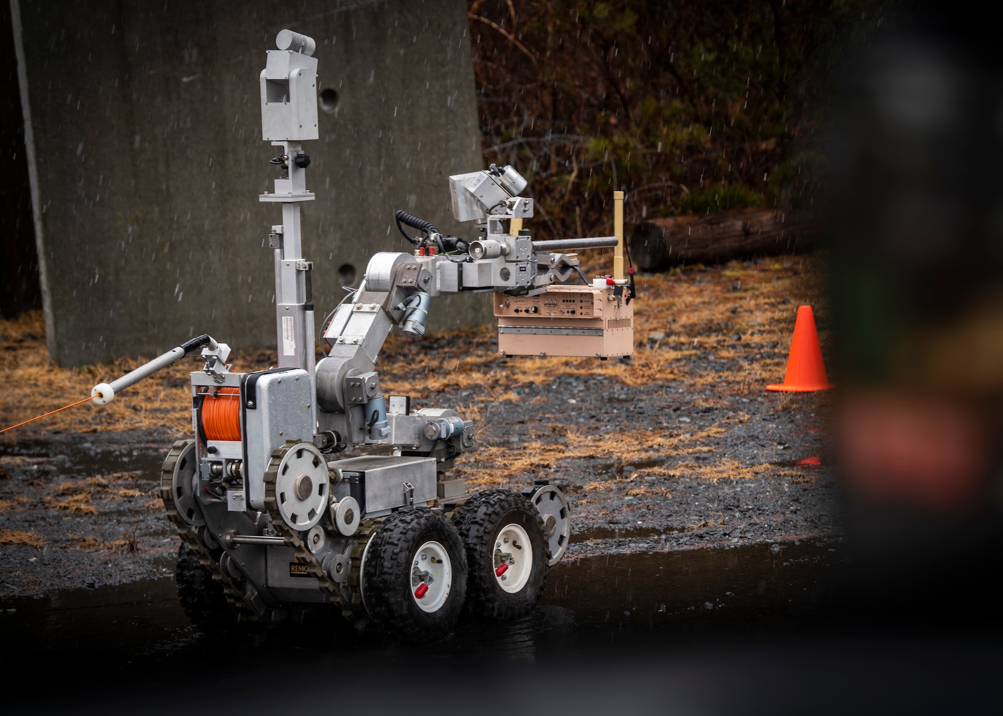 Members of the 35th Civil Engineer Squadron explosive ordnance disposal team use an F6A robot to approach a simulated improvised explosive device at Misawa Air Base, Japan, March 3, 2020. The robots enter areas inaccessible or too dangerous for people and handle potential explosives without risking any lives. (U.S. Air Force photo by Airman 1st Class China M. Shock)