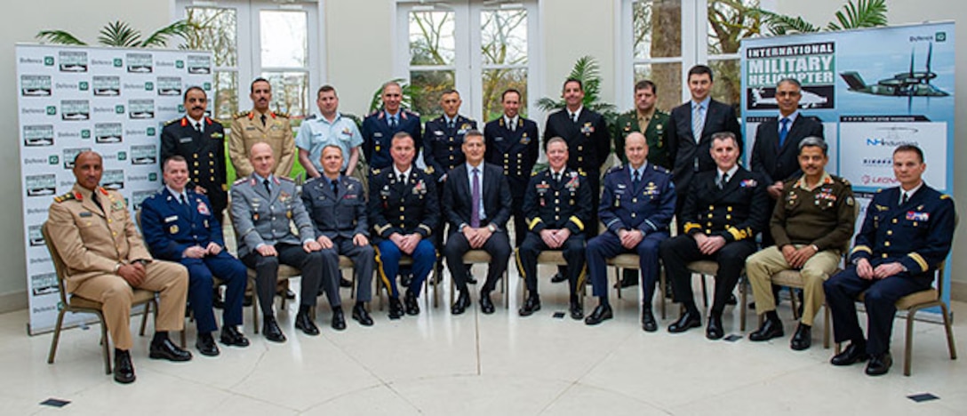 Senior leaders pose for photo at symposium