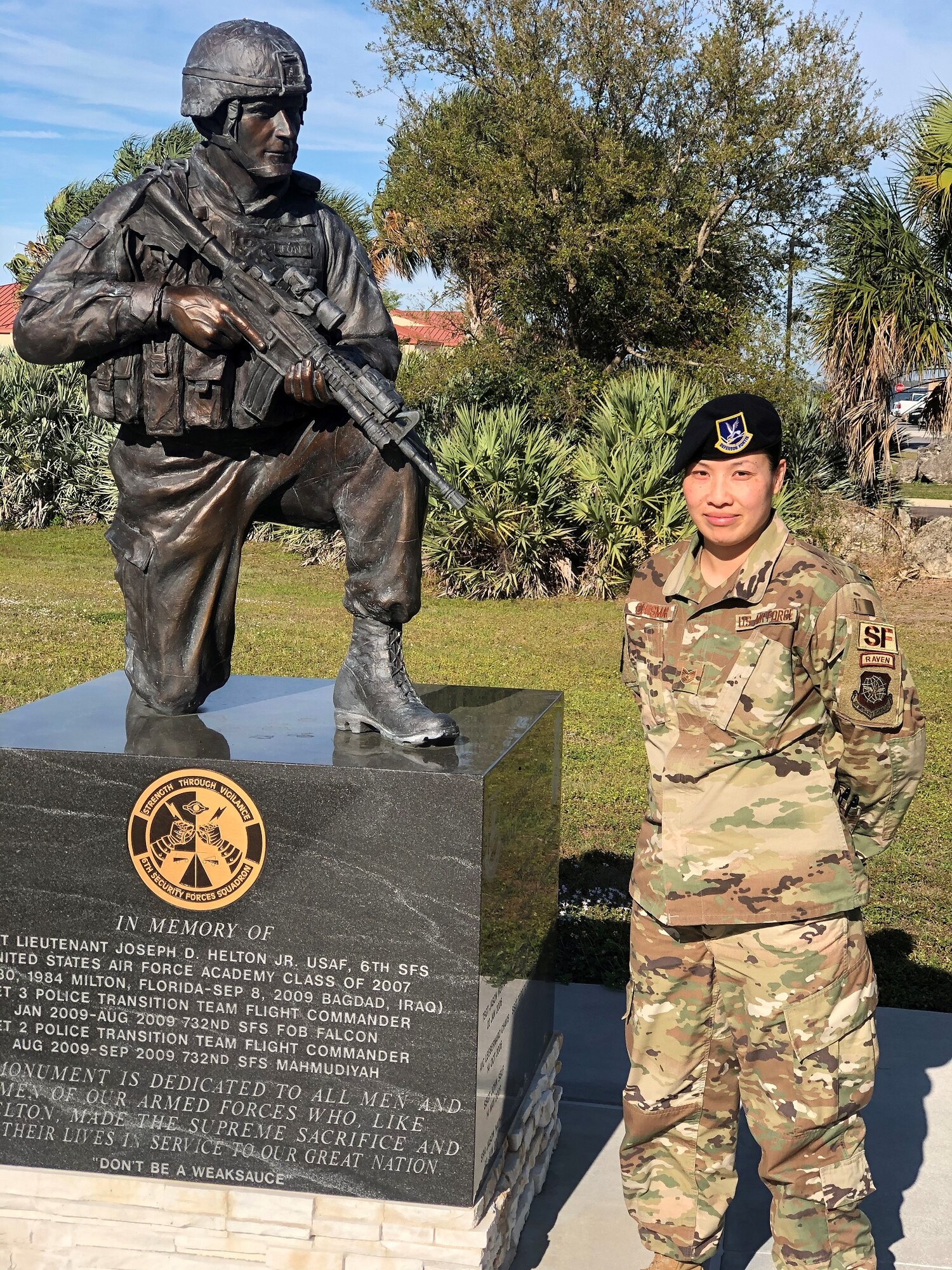 Tech. Sgt. Amy Chismar, 6th Security Forces Squadron, stands next to a memorial dedicated to 1st Lt. Joseph D. Helton a security forces officer assigned to the 6th Security Forces Squadron, who was killed during his deployment to Iraq in 2009. (Courtesy photo)