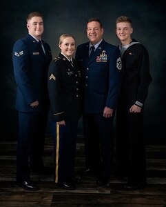 Senior Airman Everett Brown, traffic management specialist, 124th Logistics Readiness Squadron; Cpl. Kassandra Brown, ammunitions specialist, G Company, 145th Brigade Support Battalion; Command Chief Master Sgt. Sid Brown, State Command Chief, Idaho Air National Guard; and Seaman Wesley Brown, hospital corpsman, Wayne Caron Clinic, Camp Lejeune, North Carolina, pose for a family photo.