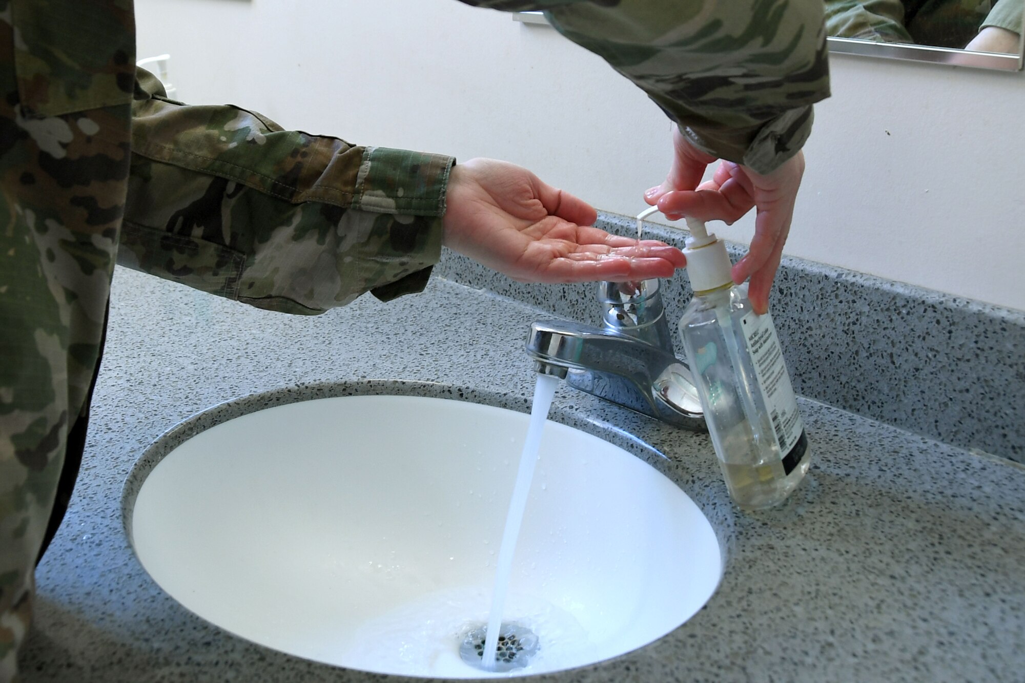 A North Carolina Air National Guardsmen washes her hands to demonstrate safe practices to prevent the spread of Coronavirus during a drill weekend, Mar. 06, 2020 at the North Carolina (N.C.) Air National Guard Base, Charlotte Douglas International Airport.  The Coronavirus, or COVID19, is spreading across the U.S.; several states, including North Carolina, have reported their first cases. Both Wake and Chatham Counties in N.C. have 2 confirmed cases of the virus.