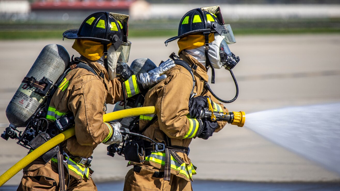 U.S. Marines control a fire hose during mobile aircraft fire training on MCAS Camp Pendleton, California, March 5.