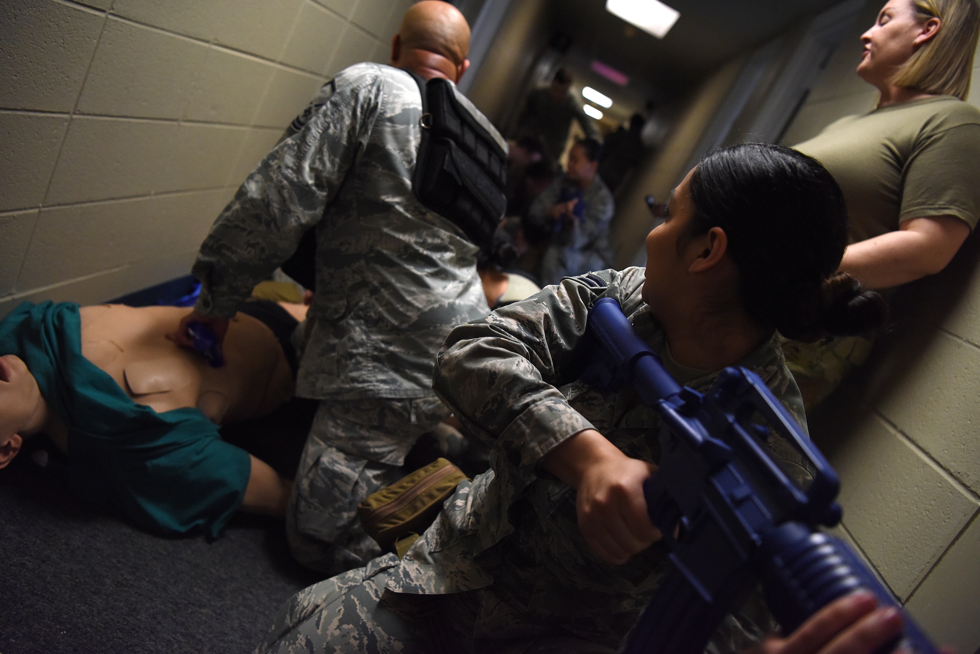 Tactical Combat Casualty Course students perform their final evaluation inside the Locker House at Keesler Air Force Base, Mississippi, Feb. 20, 2020. The TCCC is replacing self-aid and buddy care to better prepare medics for deployed environments. (U.S. Air Force photo by Senior Airman Suzie Plotnikov)