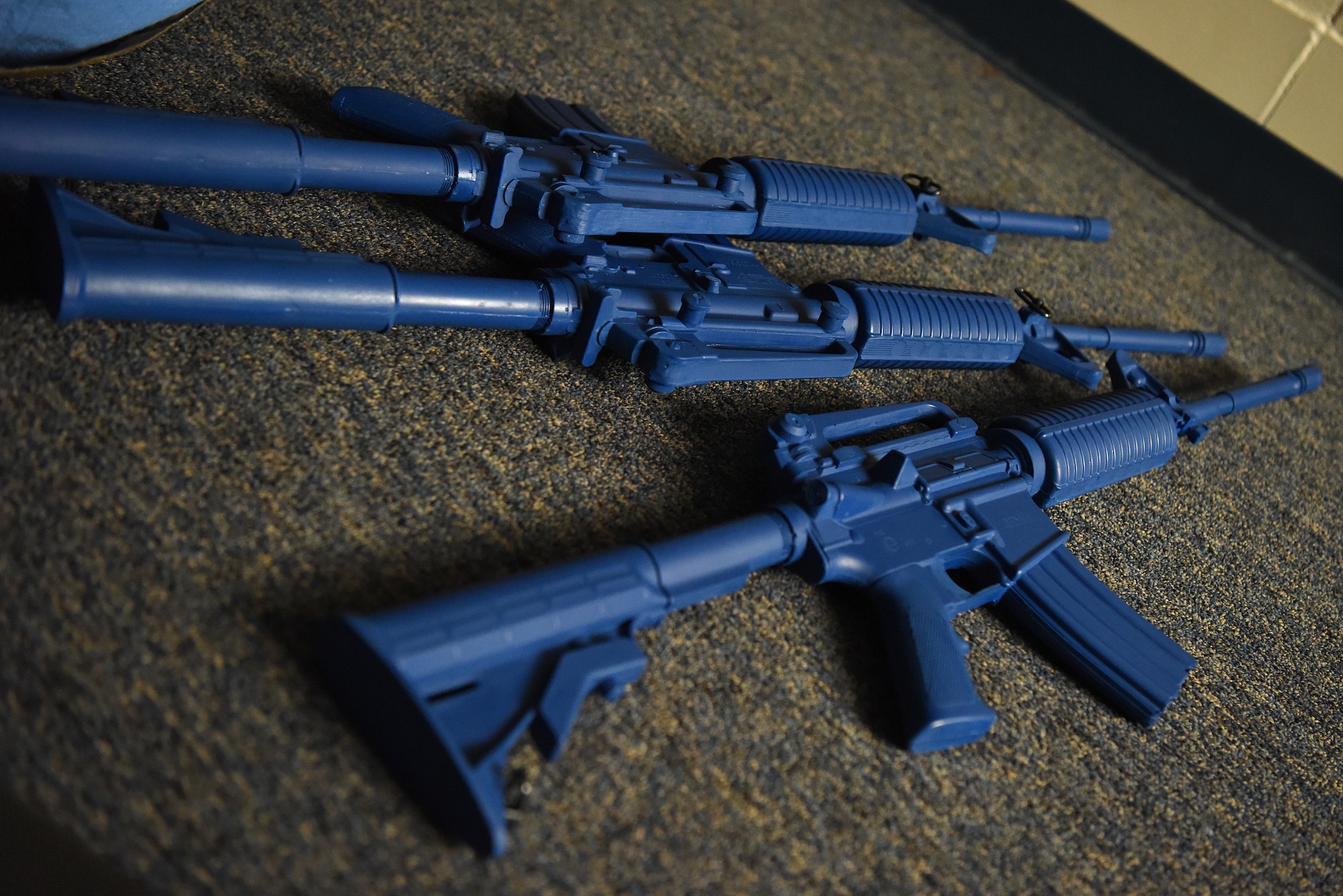 Weapons are displayed during the Tactical Combat Casualty Course inside the Locker House at Keesler Air Force Base, Mississippi, Feb. 20, 2020. The TCCC is replacing self-aid and buddy care to better prepare medics for deployed environments. (U.S. Air Force photo by Senior Airman Suzie Plotnikov)