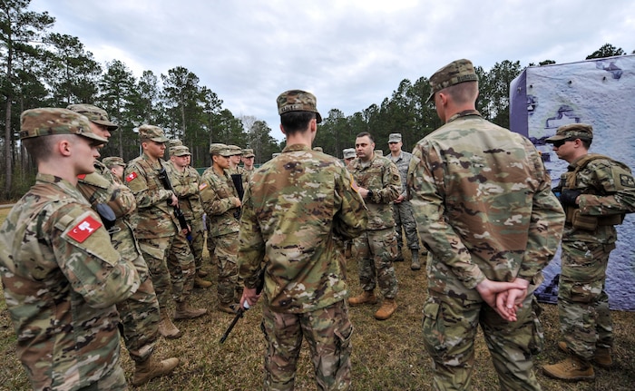 Tech. Sgt. Christopher Marino, 628th Security Forces Squadron flight sergeant, briefs cadets from the Citadel during a joint training exercise at the Naval Weapons Station Charleston, Joint Base Charleston, S.C., March 3, 2020.