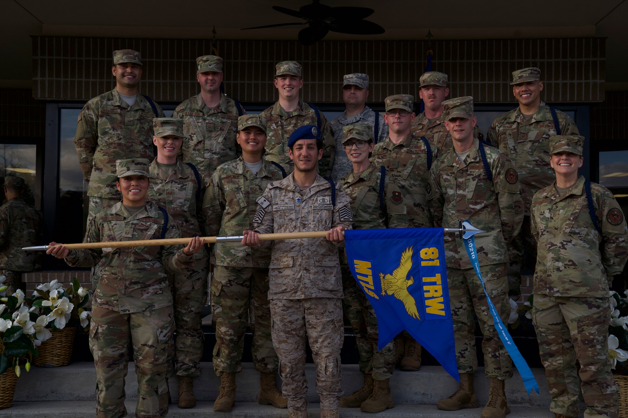 Military Training Leader course students pose for a picture during the MTL course graduation ceremony outside the Levitow Training Support Facility at Keesler Air Force Base, Mississippi, March 5, 2020. Royal Saudi air force Senior Master Sgt. Oaid Al-Bogami, 81st Training Support Squadron MTL course student, was the first international student the MTL schoolhouse graduated in approximately three years. (U.S. Air Force photo by Airman 1st Class Spencer Tobler)