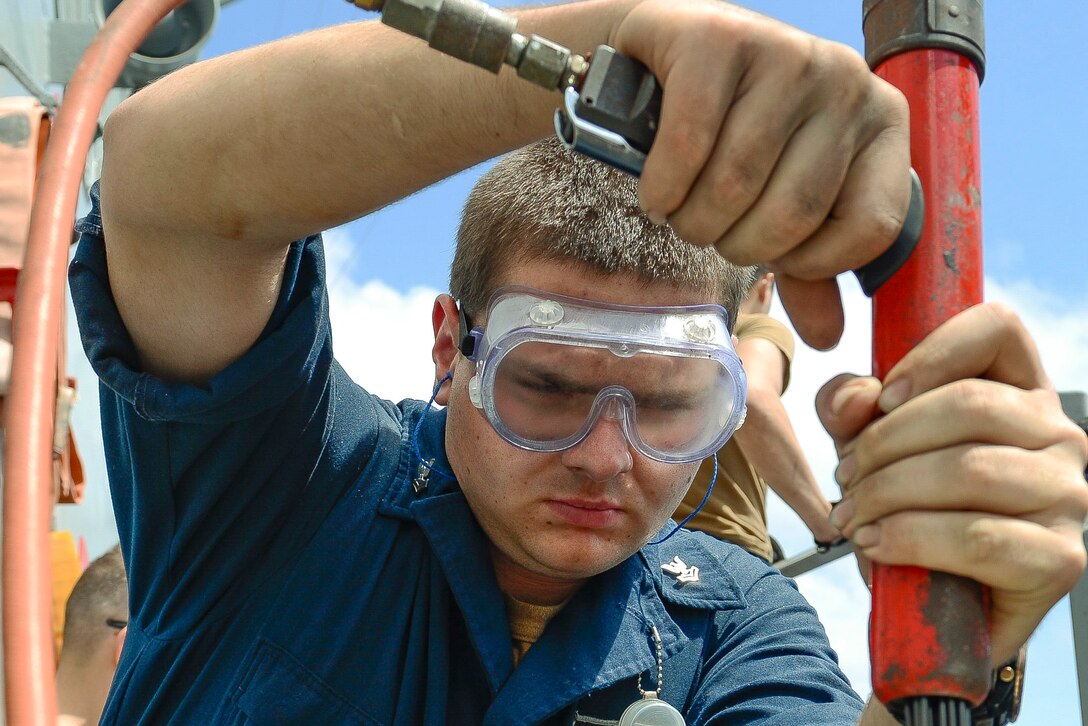 A sailor use a red needle gun.